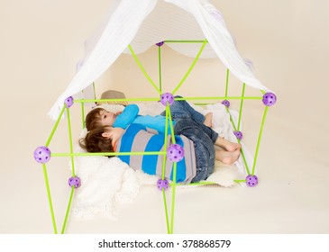 Kids, Children, Playing With A Tent Or Fort Made Out Of Blankets, Imagination, Pretend Play Concept