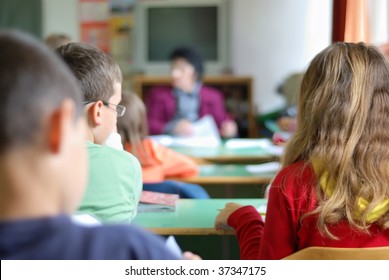 Kids In Classroom Studying, Photographed From Behind