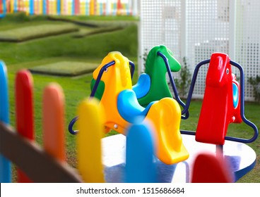 Kids Club Or Kinder Garden Horses Carousel Ride In Colorful Environment