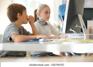 Kids In Computer Lab Working On Desktop Computer