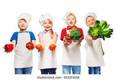 Kids In Cook's Uniform Holding Fresh Vegetables