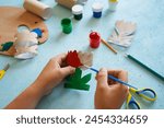 Kids craft flowers out of recycling toilet paper roll, zero waste concept. Step by step tutorial - 4.