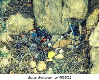 Kids Create Nativity From Plastic Figures And Natural Materials. Hikers Go Around Put There Small Presents.