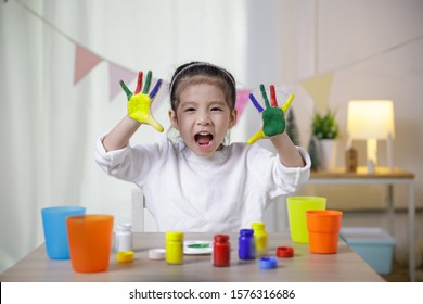 Kid's Creativity, Child Little Asian Girl Hands Painted In Colorful Paints In The Class Room At Home, Educational Concept For School