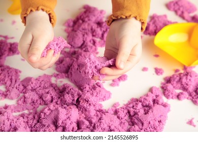 Kids Creativity. Kinetic Sand Games For Child Development At Home. Sand Therapy. Children's Hands Making Moldes. Top View