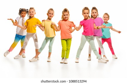 The Kids Dance School, Ballet, Hiphop, Street, Funky And Modern Dancers On White Studio Background. Girl Is Showing Aerobic And Dance Element. Teen In Hip Hop Style