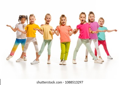 The Kids Dance School, Ballet, Hiphop, Street, Funky And Modern Dancers On White Studio Background. Girl Is Showing Aerobic And Dance Element. Teen In Hip Hop Style