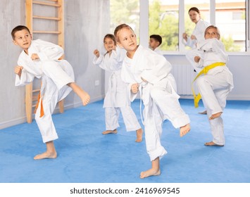 Kids are dedicated to their martial arts training, diligently working on their stances and techniques every day. - Powered by Shutterstock