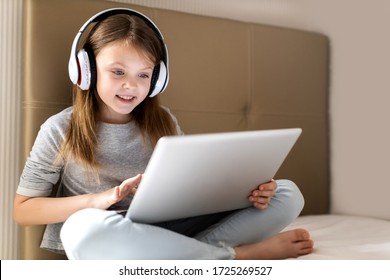 Kids Distance Learning. Cute Little Girl Using Laptop At Home. Education, Online Study, Home Studying, Technology, Science, Future, Distance Learning, Homework, Schoolgirl Children Lifestyle Concept.