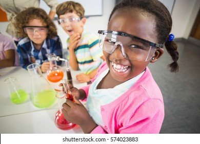 Kids doing a chemical experiment in laboratory at school