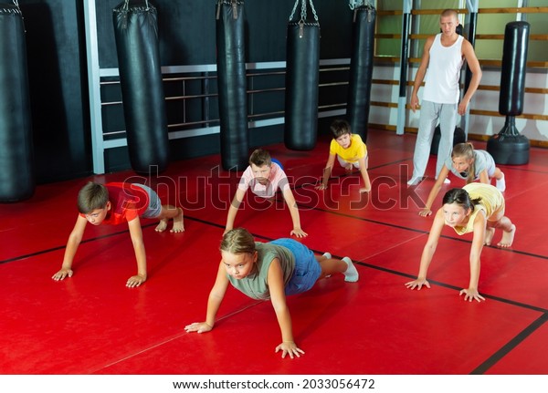 Kids Doing Pushups On Gym Floor Stock Photo 2033056472 | Shutterstock