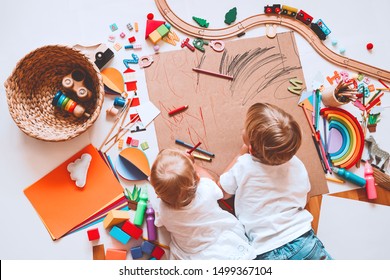 Kids draw and make crafts. Children with educational toys and school supplies for creativity. Background for preschool and kindergarten or art classes. Boy and girl play at home or daycare