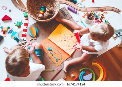 Kids draw and make crafts. Children with educational toys and school supplies for creativity. Background for preschool and kindergarten or art classes. Boy and girl play at home or daycare