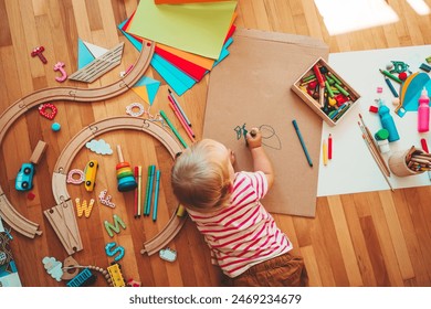 Kids draw and make crafts. Children with educational toys and school supplies for creativity. Background for preschool and kindergarten or art classes. Boy and girl play at home or daycare - Powered by Shutterstock