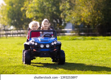 children driving car toys
