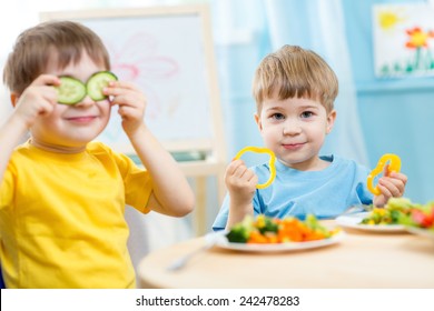 kids eating healthy food in kindergarten or at home - Shutterstock ID 242478283