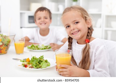 Kids Eating A Healthy Meal In The Kitchen