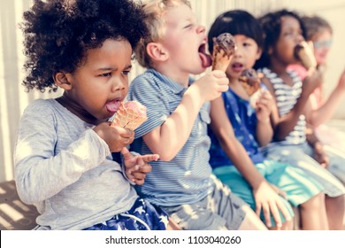 Kids Eating Ice Cream In The Summer