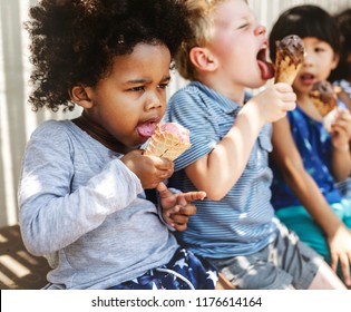 Kids Eating Ice Cream In The Summer