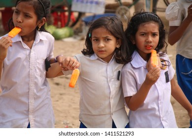 Kids Are Enjoying Ice In The Sunny Day. This Photo Was Taken At Sunamganj District In Bangladesh. 