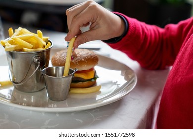 Kids Favourite Food - Mini Burger And French Fries. Family Dinner In Restaurant.