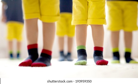 Kids Feet In Different Socks