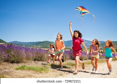 Kids Flying Kite Running Through Lavender Field