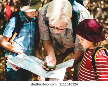 Kids Following The Directions Of A Compass