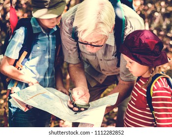 Kids Following The Directions Of A Compass