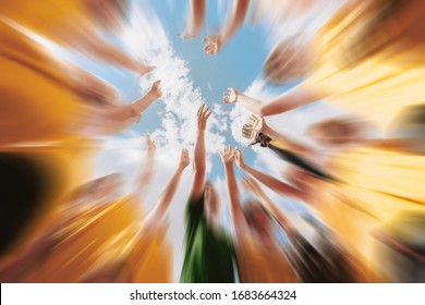 Kids football team stacking hands with coach before a match. Children sports team in a circle. Happy soccer team shout out - Powered by Shutterstock