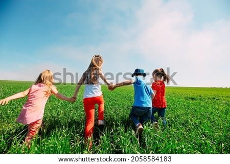 Similar – Image, Stock Photo Rear view child playing with scooter