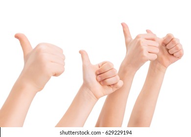 Kids gesturing thumbs up isolated on white