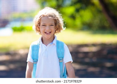 Kids Go Back To School. Interracial Group Of Children Of Mixed Age Run And Cheer On The First Day Of New Academic Year. Start Of School Holiday. Preschooler Or Kindergarten Kid. Child In School Yard.