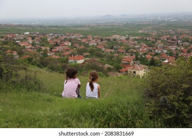 Тwo Kids In The Grass Above The Village