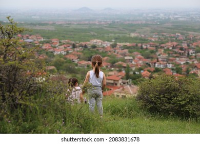 Тwo Kids In The Grass Above The Village