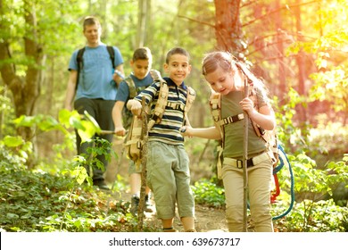 Kids In Green Forest Playing,concept Of Kids Vacations And Travel