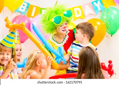 Kids Group And Clown Celebrating Birthday Party