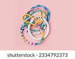 Kids handmade beaded jewelry. Necklaces and bracelets made from multicolored beads and pearls. DIY bracelet beads. Children
