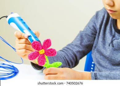 Kids Hands Making Flower With 3d Printing Pen.