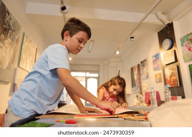 Kids have art class, drawing, painting with teacher in workshop, enhancing creativity and artistic skills. - Powered by Shutterstock