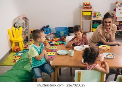 Kids Having Breakfast In Kindergarden