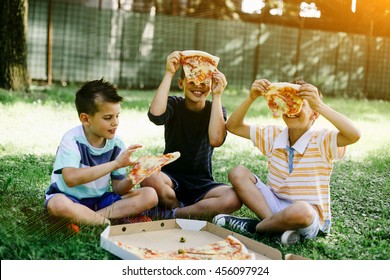 Kids Having Fun Eating Pizza