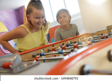 Kids Having Fun Playing Foosball