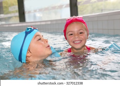 Kids Having Fun At The Swimming Pool