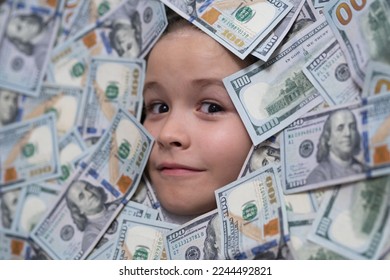 Kids how to be rich. Child with dollar bills near face. Money banknotes, cash dollars bills. Financial independence and ability to earn a lot of money.