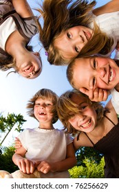 Kids In A Huddle Having Fun And Looking Down