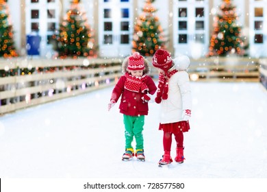 Kids Ice Skating In Winter Park Rink. 