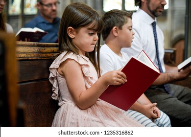 Kids joining their father in prayer
