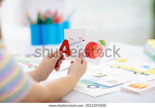 Kids learn to read. Colorful abc phonics flash
cards for kindergarten and preschool children. Remote learning and
homeschooling for young kid. Child reading sounds and letters.
English lesson.