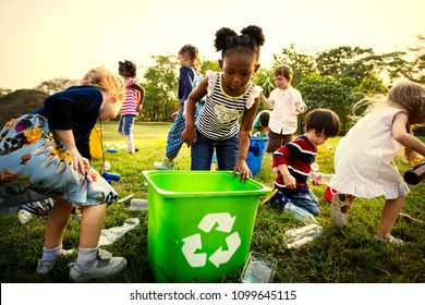 Kids learning how to recycle trash - Powered by Shutterstock